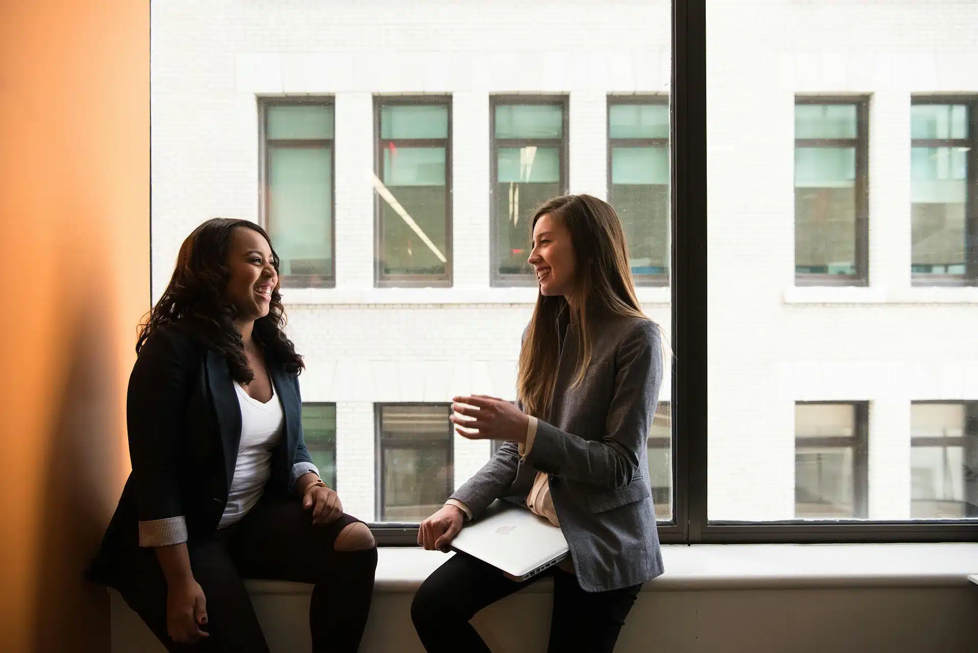 Team meeting in glass-walled inclusive office space