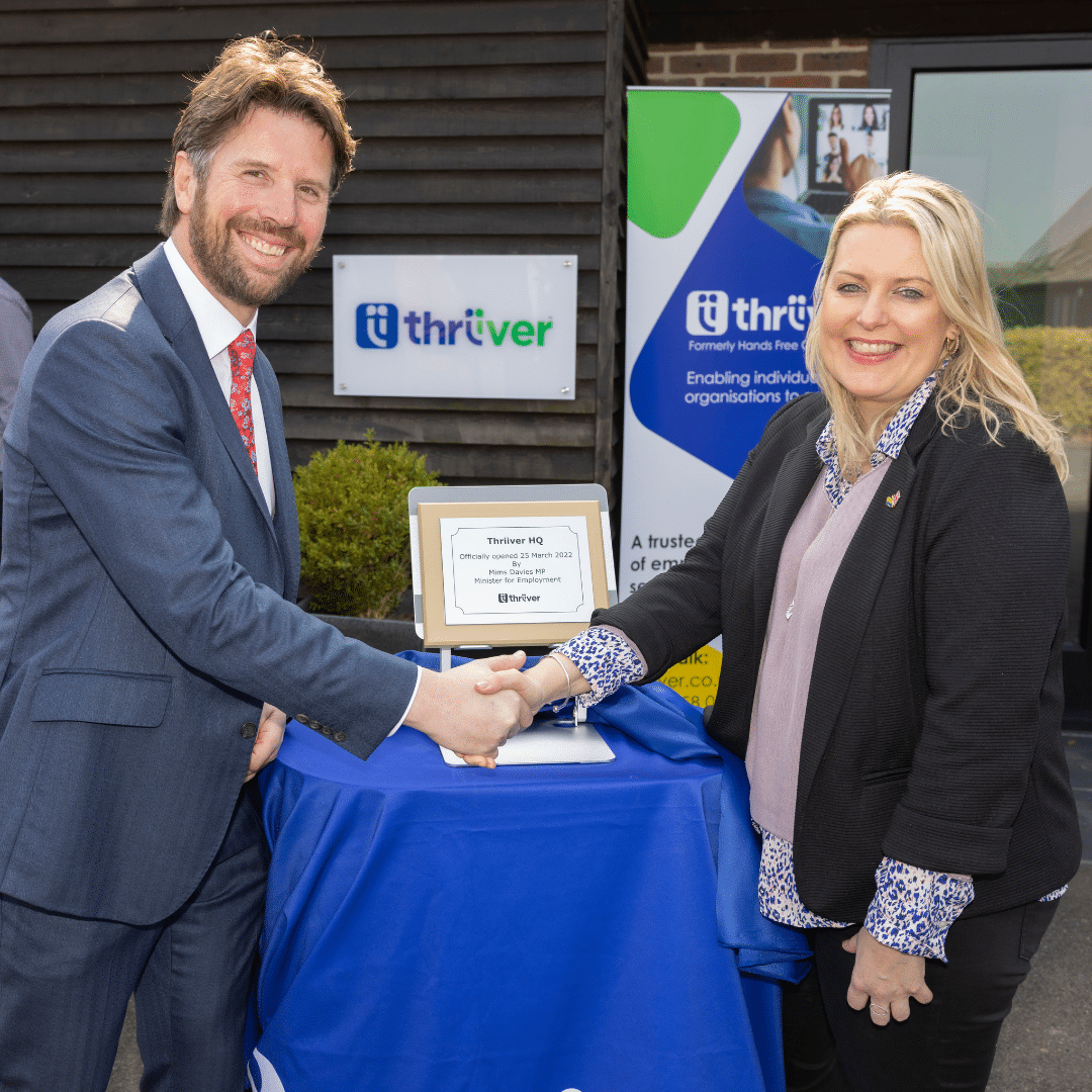 Lawrence Howard, CEO of Thriiver, shaking hands with Mims Davies MP in front of the new plaque